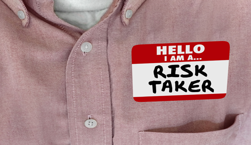 Name tag with the words Risk Taker on it